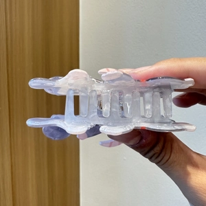 Detail of translucent purple marble hair claw clip with strong acetate teeth and spring