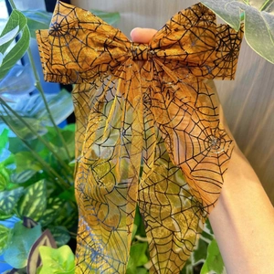 Barrette à cheveux d'Halloween avec nœud en mesh orange et motifs de toile d'araignée