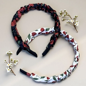 Detail of bohemian cherry print headbands with soft fabric texture and non-slip ends