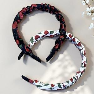 Detail of sweet cherry print headbands in black and white fabric for a bohemian style