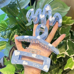 Three-piece light blue denim texture hair claws set with white heart patterns and text
