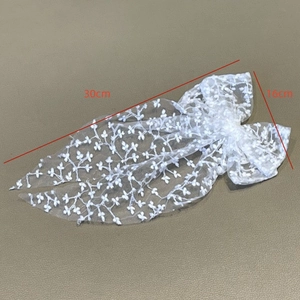Elegant white lace bow hair clip with floral embroidery and long ribbons for weddings