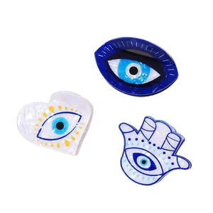 Evil eye hair claw clip set with hamsa hand and heart designs in blue acetate finish