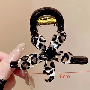 Close-up of 8cm elegant leopard print flower hair claw clip with black glossy finish