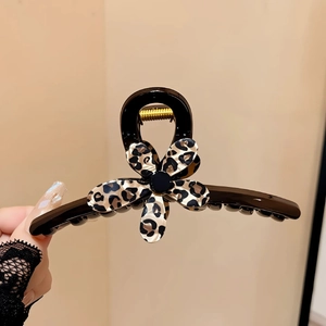 Elegant leopard print flower hair claw clip with black polished finish and gold spring