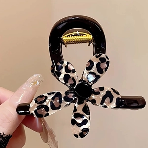 Elegant leopard print flower hair claw clip with black finish and gold metal spring