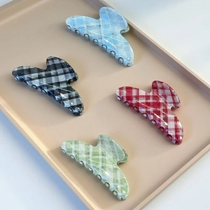Checkered hair claw clips in blue, grey, red and green colors for elegant hairstyles