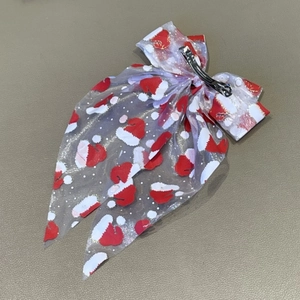 Barrette de Noël avec nœud en maille blanche, motifs de bonnets de Noël et paillettes dorées