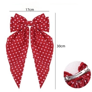 Elegant red polka dot bow hair clip with long streamers and silver spring clip back