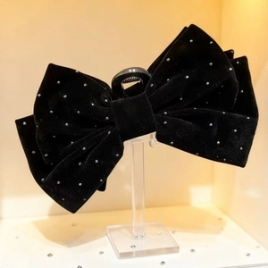 Eleganter Haarclip aus schwarzem Samt mit Schleife und silbernen Strasssteinen