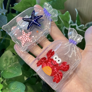 Pince à cheveux créative en bouteille transparente avec motifs étoile de mer et crabe