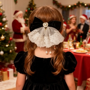 Rear view of a girl wearing a black velvet bow hair clip with white lace and pearls