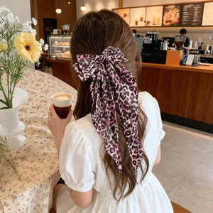 Elegant large leopard print bow hair clip with long ribbons for women's hairstyle