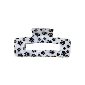 Pince à cheveux blanc nacré avec motifs pattes de chat noires pour coiffure élégante