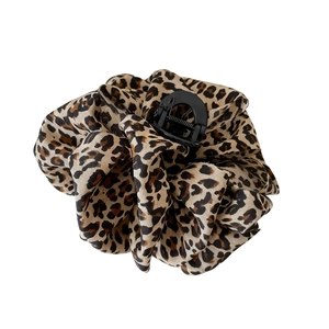 Detail of 13cm leopard print bubble hair claw clip featuring soft pleated fabric texture