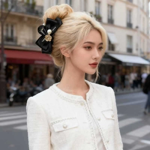 Elegant camellia bow hair claw clip with pearls for French style updo hairstyles