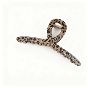 Close-up of large brown leopard print hair claw clip with glossy resin finish