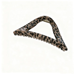 Detail of a triangular leopard print hair claw clip with golden metal spring mechanism