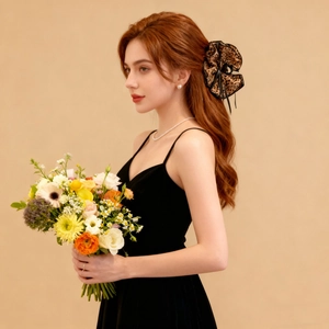 Detail of leopard print hair scrunchie with black lace trim on long wavy hair