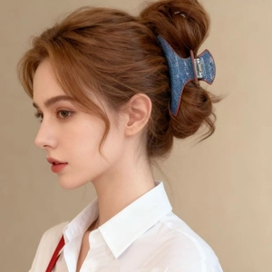 French style denim blue hair claw with red edges worn in an elegant updo hairstyle