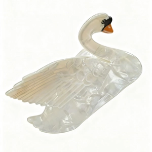 Elegant swan hair claw clip with cream marble texture and pearl finish on white background