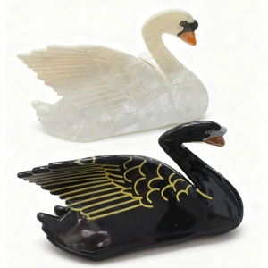 Elegant swan-shaped hair claws in black and white pearlescent finish for women