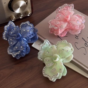 Elegant floral acetate hair claws with rhinestones in pink, blue, and green colors