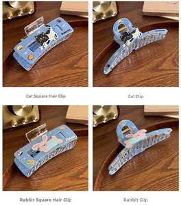 Detail of cute cat and rabbit embroidered patterns on blue denim hair claw clips