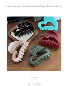 Detailed view of large resin hair claws showing dimensions 8.8cm and various colors