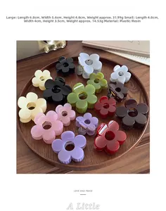 Close-up of elegant flower hair clips in various colors displayed on a wooden tray