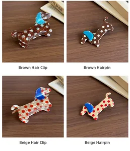 Detail view of cute dachshund acetate hair clips with polka dots in brown and beige colors