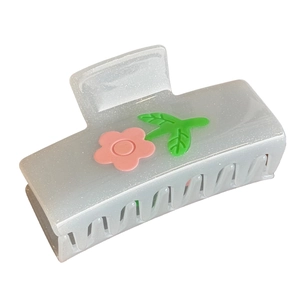 Translucent white flower hair claw clip with pink floral and green leaf relief design