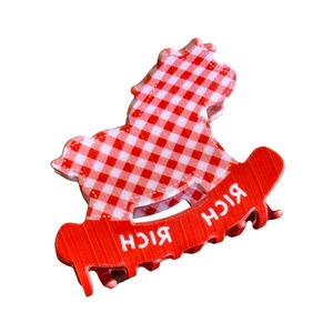 Pince à cheveux cheval à bascule rouge et blanc avec motif à pois et texte rich