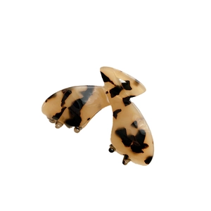 Pince à cheveux minimaliste en acétate avec motif léopard écaille de tortue vintage sur blanc