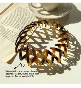 Macro shot of dark brown tortoiseshell bird nest hair clip with sharp shadow details