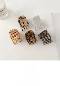 Set of 5 acetate hair claws in tortoise shell and marble patterns measuring 3.4x4.8cm