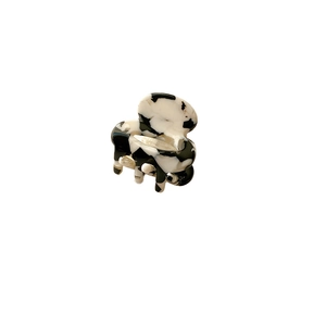 Mini acetate hair claw clip with black and white marble pattern and gold metal spring