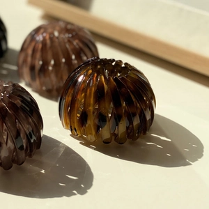 Adjustable bird nest hair clips in amber tortoiseshell pattern for high ponytail styles