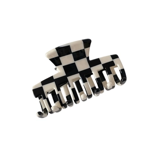 Classic checkered black and white acetate hair claw clip for elegant hair styling