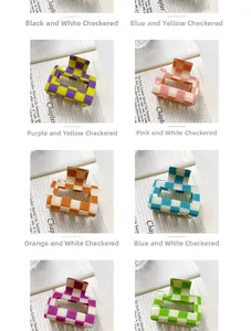 Detail of colorful checkered acrylic hair claws in six vibrant color patterns