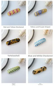 Close-up of oval checkerboard and acetate hair clips in six stylish assorted patterns