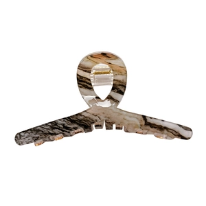 Large acrylic hair claw clip with marble texture and golden metal spring mechanism