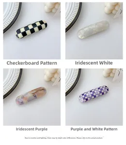 Set of four stylish checkered and marble pattern hair clips in acetate finish