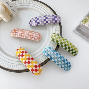 Chic retro checkered pattern hair clips in multiple vibrant colors on a white tray