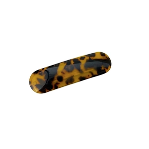 Elegant tortoise shell oval spring hair clip with retro checkered pattern on white background
