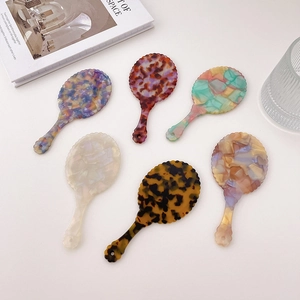 Portable acetate shell handheld mirrors in tortoiseshell and marble patterns for makeup