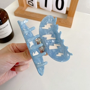 Blue marble texture hair claw clip with white lightning pattern for women's hairstyle