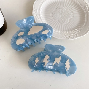 Sky blue acetate hair claw clips with marble texture, cloud and lightning patterns