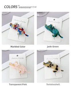Detailed view of four acetate cat hair clips in various marble and tortoiseshell patterns