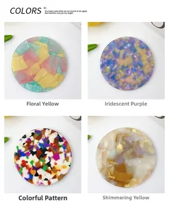 Detailed view of four retro acetate portable round mirrors with colorful marble textures